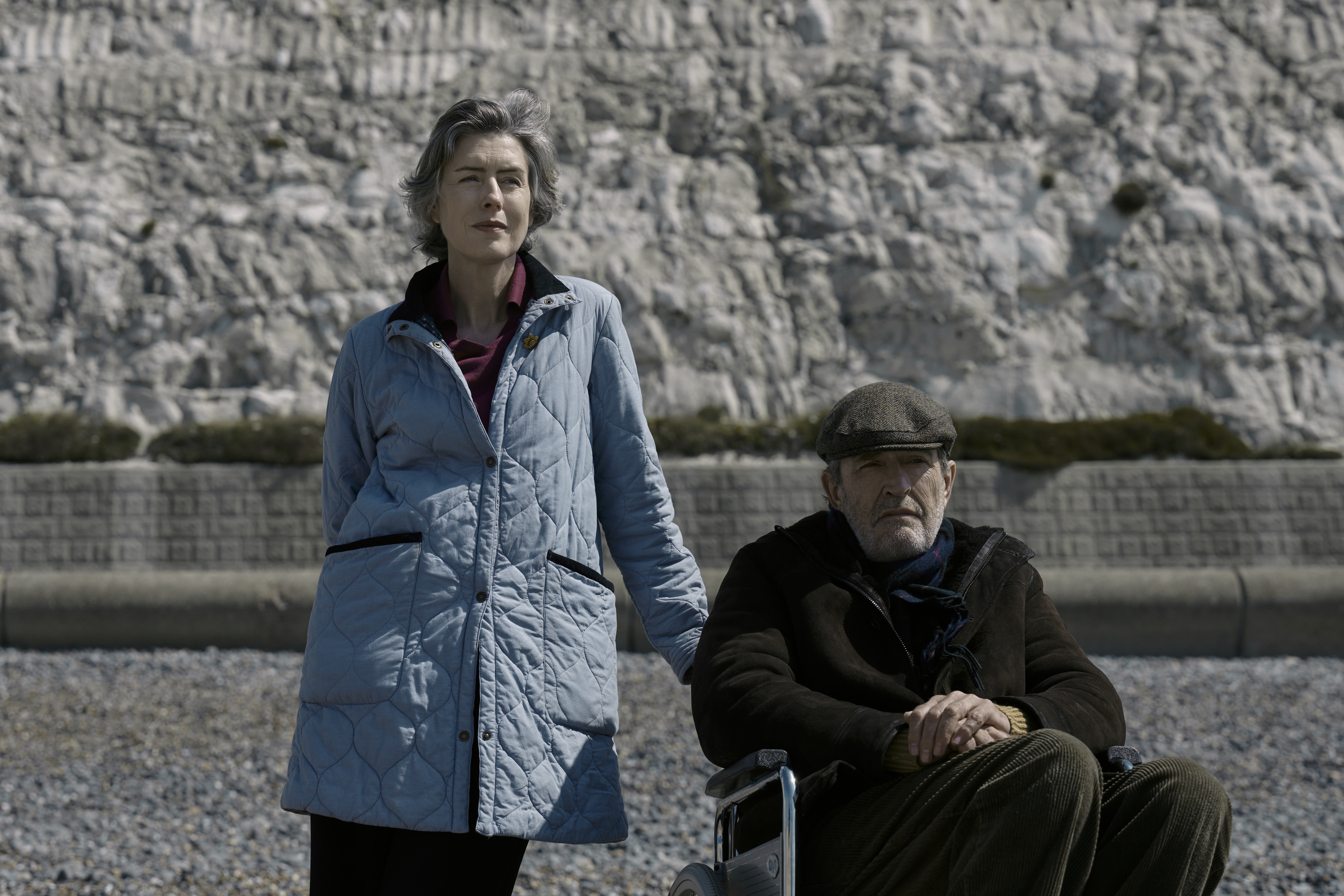 Two old people on a beach